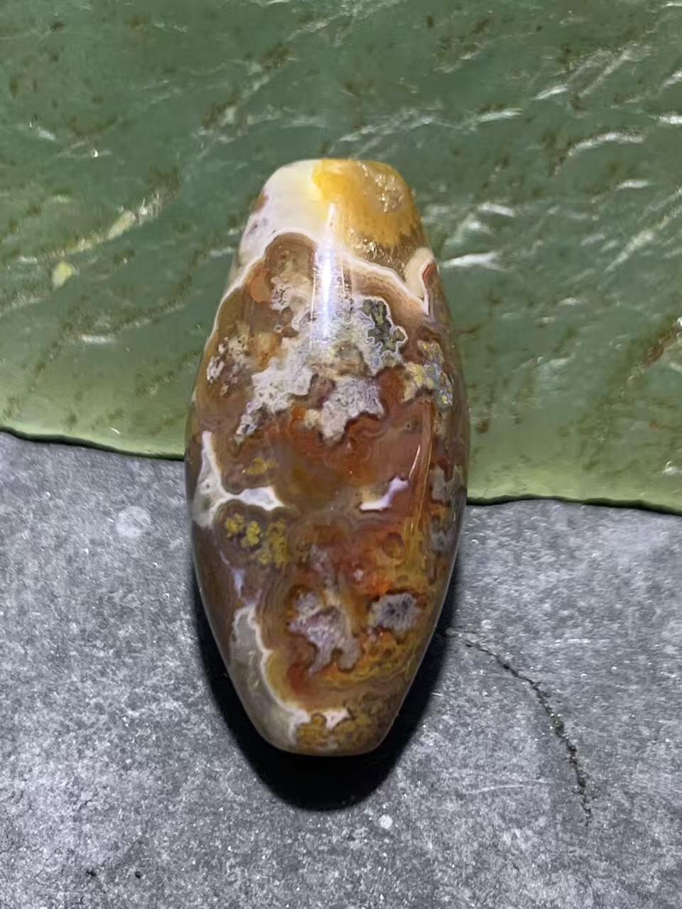 精美冰飘草花纹战国红玛瑙天珠形桶珠一个