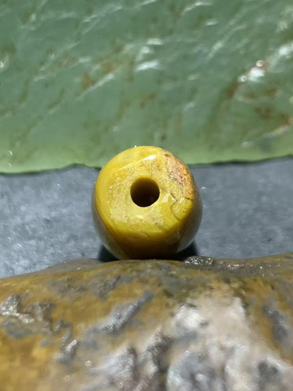 冰飘草花纹战国红玛瑙通货桶珠一颗！