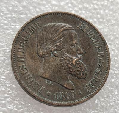 外国优质老铜币高银银币，周六九点倒数截拍，满百包邮，持续收拍，年后发货 - 巴西帝国 1869 年20 瑞斯铜币，属于佩德罗二世统治时期，正值巴拉圭战争后期。它见证了巴西帝国鼎盛阶段的货币体系，铜币的发行既满足了战时经济流通需求，也反映了帝国的政治权威与经济特征。