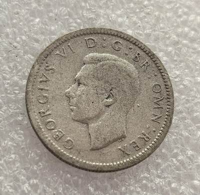 外国优质老铜币高银银币，周六九点倒数截拍，满百包邮，持续收拍，年后发货 - 英国 1944 年  六便士银币，属于乔治六世时期的流通货币。时值二战关键阶段，该币以国王缩写 “GR” 与皇冠为设计，见证了英国战时的货币体系维系与国家凝聚力，是二战时期英国社会经济的重要遗存。