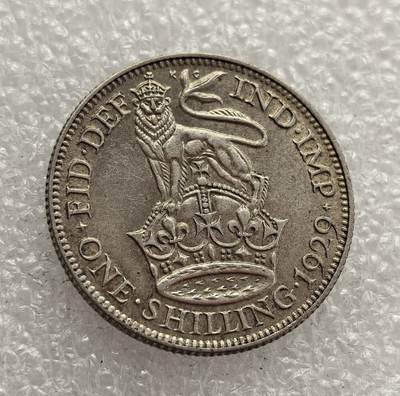 外国优质老铜币高银银币，周六九点倒数截拍，满百包邮，持续收拍，年后发货 - 英国 1929 年 1 先令银币，属于乔治五世时期的流通货币。当时英国正处于战后经济调整阶段，该币以 “皇冠上的狮子” 为设计，象征君主权威与国家稳定，是 20 世纪 20 年代英国维系货币体系与殖民霸权的重要见证。