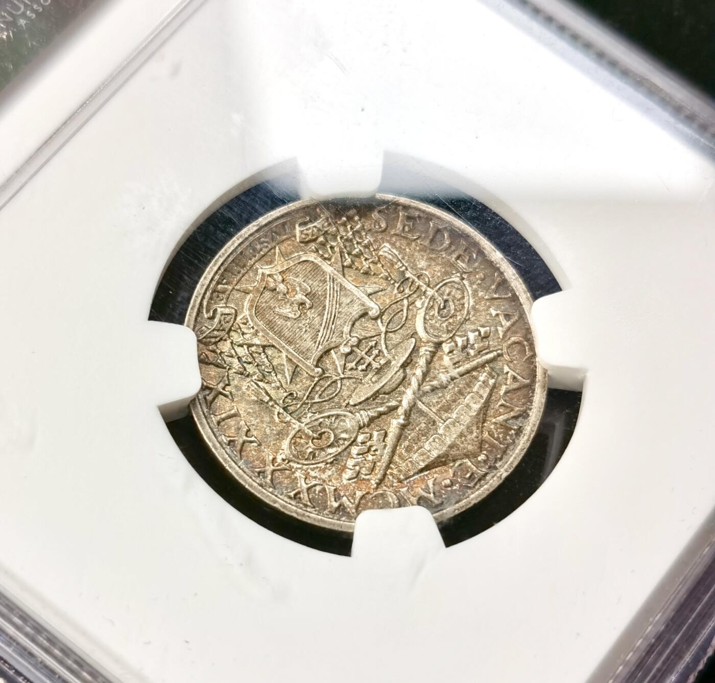 甄臻铺-世界币章拍卖（第49期）精品场拍品征集中，送拍享返佣金等优惠多多 NGC-AUD 1939年梵蒂冈教皇缺位 5里拉 经典欧洲彩