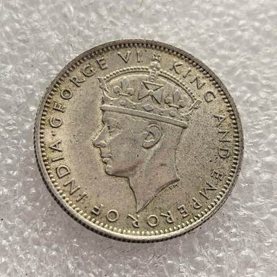 外国优质老铜币高银银币，周六九点倒数截拍，满百包邮，持续收拍，年后发货 - 马来亚 1939 年   20 分银币，属于乔治六世时期的流通货币。当时马来亚处于英国殖民统治下，该币由货币专员署发行，见证了殖民时期马来亚的货币体系建设，也是二战前夕东南亚殖民经济与政治格局的重要遗存。