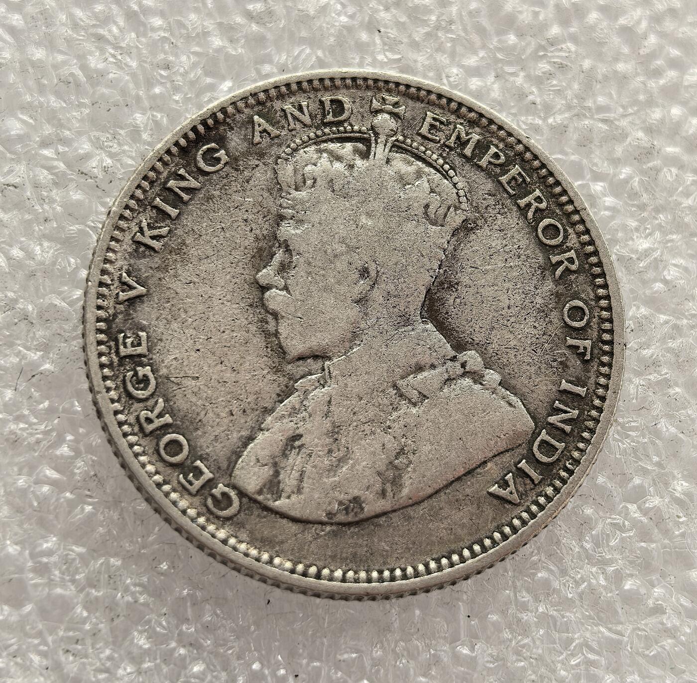 外国优质老铜币高银银币，周六九点倒数截拍，满百包邮，持续收拍，年后发货 英属海峡殖民地 1927 年   20 分银币，属于乔治五世时期的流通货币。当时海峡殖民地是英国在东南亚的商贸枢纽，该币以国王头像与面值为设计，见证了英国殖民统治下东南亚的货币体系与商贸发展，是殖民经济的重要遗存。