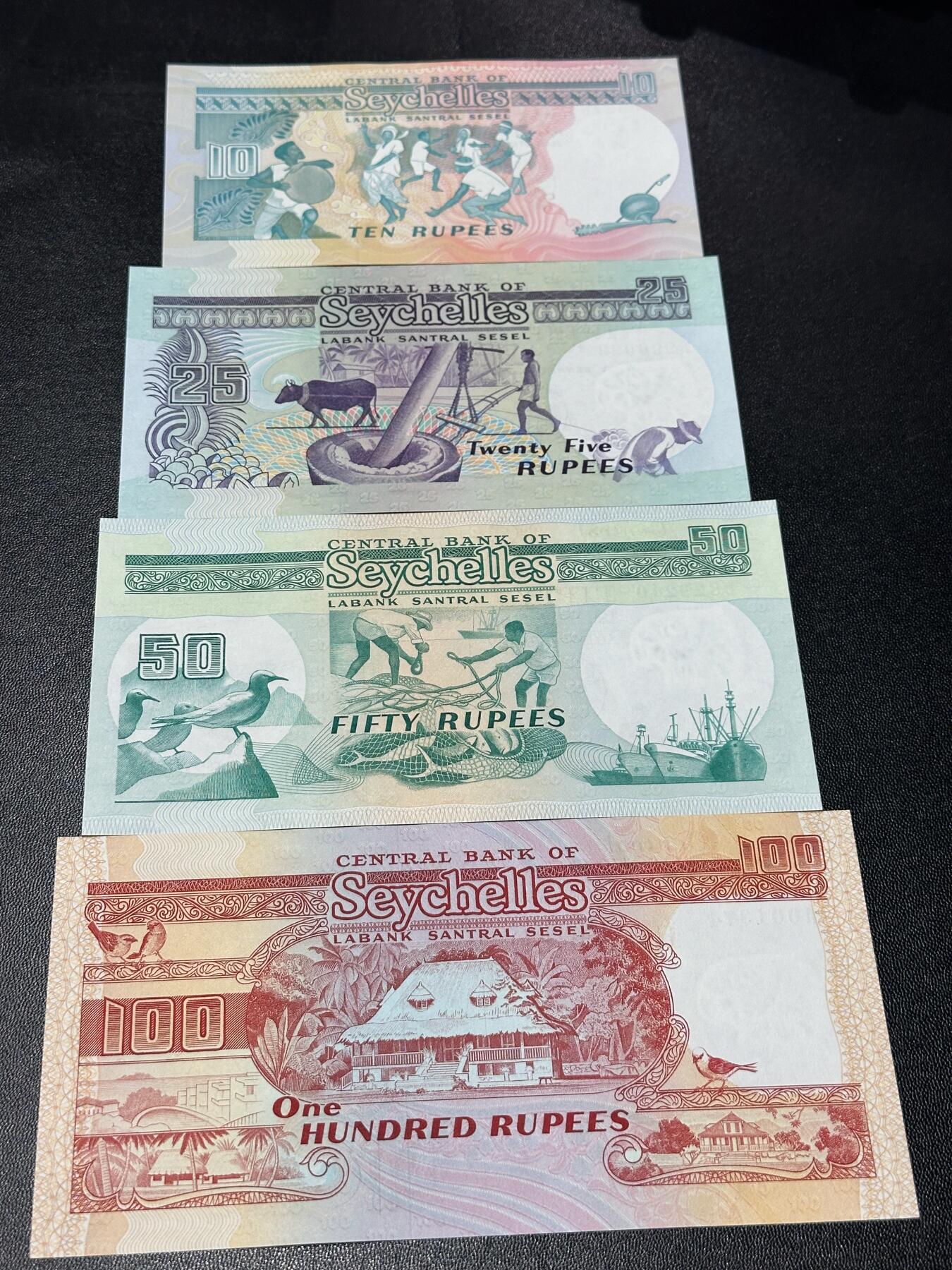 《外钞收藏家》第六百零九期（农历年前收官场、本期年后快递恢复正常再发货）（本平台长期征集拍品、欢迎藏友们联系合作） 塞舌尔老版本10/25/50/100卢比4张一套（10与25全程无47）		UNC