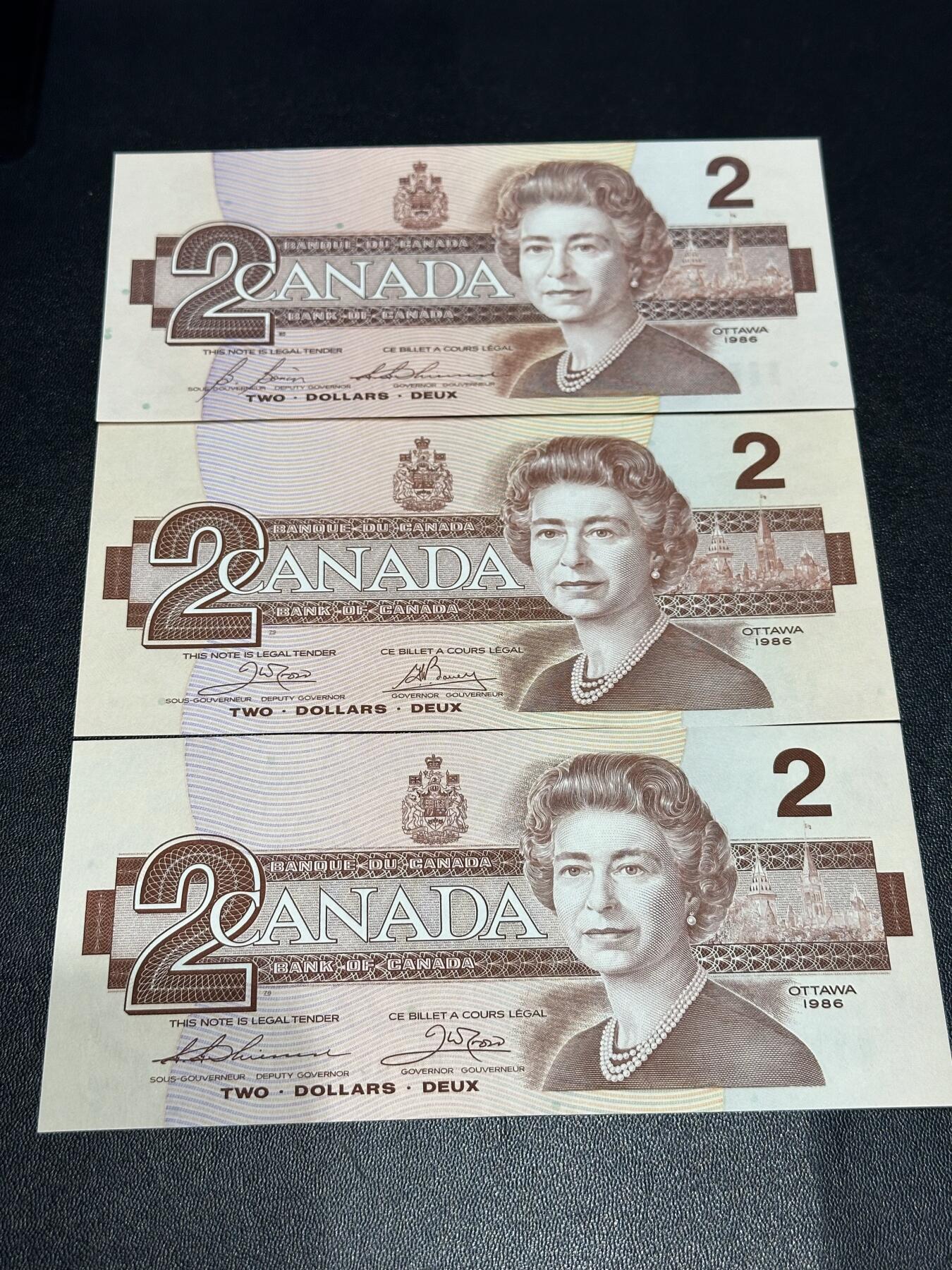 《外钞收藏家》第六百零九期（农历年前收官场、本期年后快递恢复正常再发货）（本平台长期征集拍品、欢迎藏友们联系合作） 加拿大1986年鸟版2元三张（全程无47；3种不同签名，其中一签较少 ）全新 有一张有个潮斑点