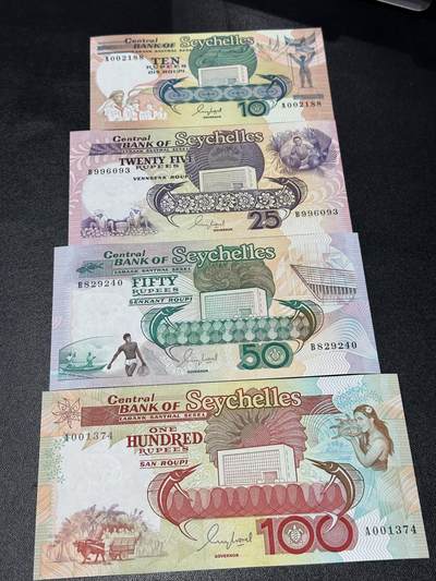 《外钞收藏家》第六百零九期（农历年前收官场、本期年后快递恢复正常再发货）（本平台长期征集拍品、欢迎藏友们联系合作） - 塞舌尔老版本10/25/50/100卢比4张一套（10与25全程无47）		UNC