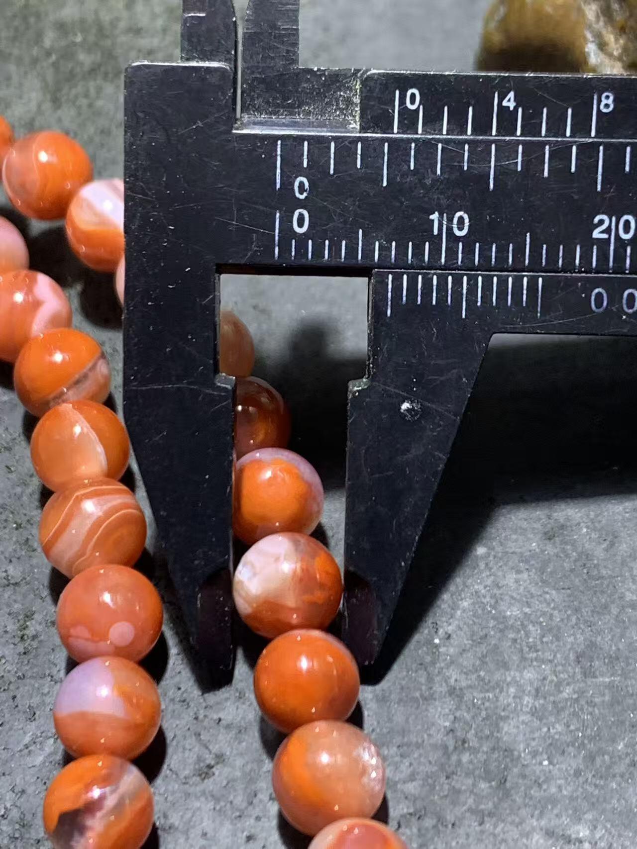 川料南红玛瑙柿子红冰飘多圈手串一条，