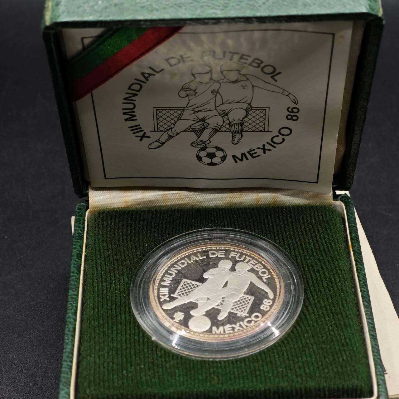 【淘币小摊】实时拍第八百七十拍   银币套币场    年前最后一场周一预留全部发出 本场无中意拍品可私信周日发货请更换最新收货地址不方便收货的请勿参拍或者顺丰到付 葡萄牙1986年100埃斯库多精制银币 86年墨西哥世界杯 925银16.5克 发行量：1万 盒证全