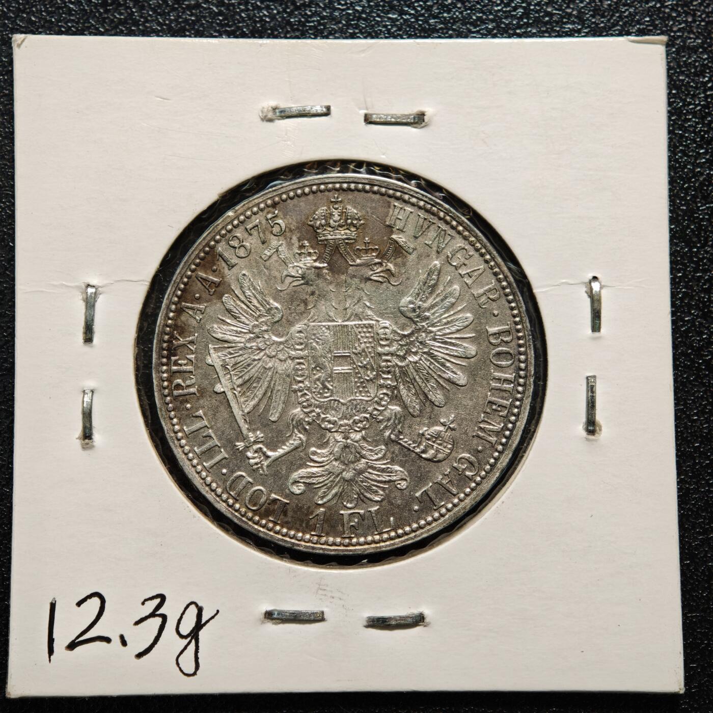 【德藏】世界币章拍卖第165期（拍品征集中~欢迎藏友联系） 老藏家集藏系列之- 1875年 奥地利1弗洛林银币 900银 直径约：29.5mm；重约：12.3g 入册20余年·附有当年购入价