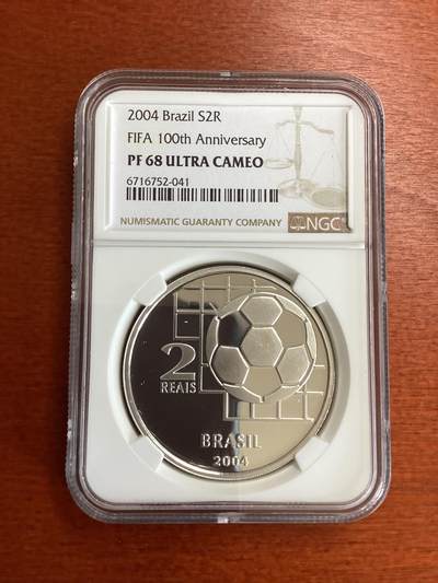 长老汇蛇年精选第一百场拍卖 -  2004 巴西世界杯百周年2里亚尔精制银币，NGC PF68UC，更高25枚，12166枚，克书价高