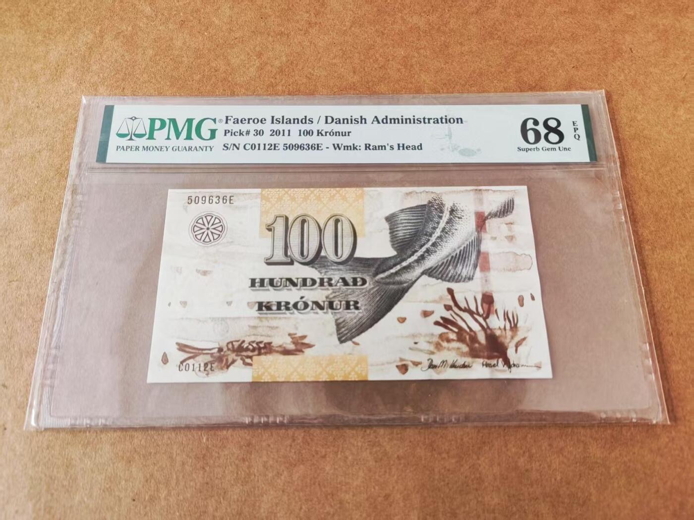 【礼羽收藏】🌏世界钱币拍卖第124期 全新PMG评分68E 法罗群岛 2011年 100克朗 粗3D防伪线 无47 尾6  高分难得