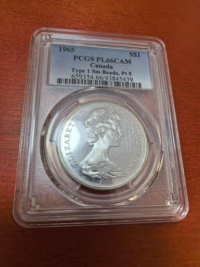 长老汇蛇年精选第一百场拍卖 - 1965加拿大伊丽莎白二世1加元类精制银币，PCGS PL66CAM，超高分，版别小珠点，尖5，65分克书标价750美金