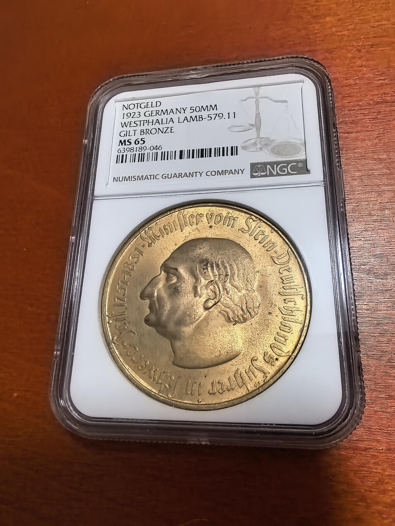 长老汇蛇年精选第一百场拍卖  1923德紧威斯特伐利亚斯坦伯爵马币1万马克镀金币，NGC MS65，宽边，季军，更高33枚