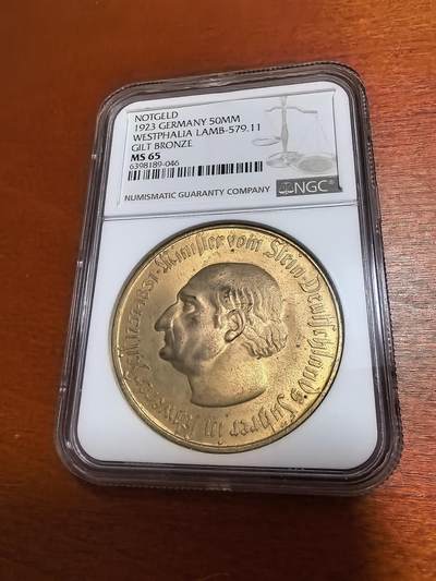 长老汇蛇年精选第一百场拍卖 -  1923德紧威斯特伐利亚斯坦伯爵马币1万马克镀金币，NGC MS65，宽边，季军，更高33枚