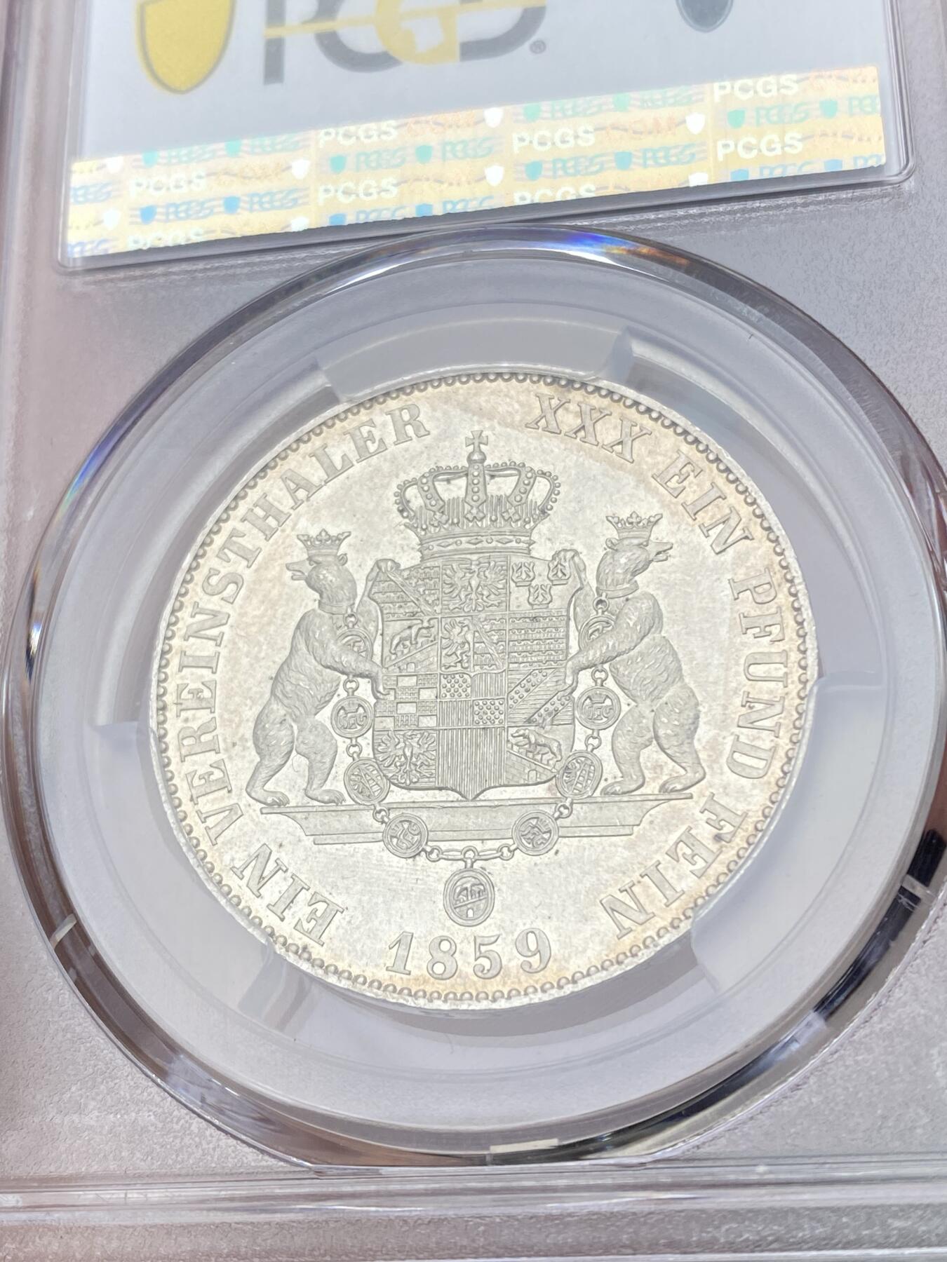 万国钱币拍卖第061期（马年首拍） PCGS MS62 1859年德国安哈尔特-贝恩堡疯王卡尔双熊纹章流通1泰勒 仅单年发行 PCGS亚军分难度极大的罕见品种 轻微镜面背面全毛双熊盾徽观感极佳的顶级收藏品质
