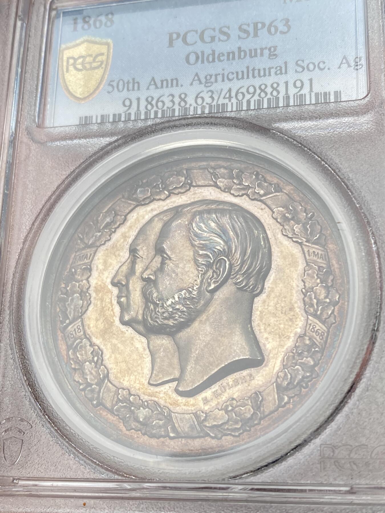 万国钱币拍卖第061期（马年首拍） PCGS SP63 1868年德国奥尔登堡大公国纪念奥尔登堡农业协会成立50周年大银章 正面奥尔登堡大公彼得·弗里德里希·路德维希与王后尼古拉斯·弗里德里希·彼得高浮雕侧相 背面农业女神端坐在中央 超高浮雕原味淡彩极美 罕见小邦品种收藏级品质 PC唯一亚军更高仅一枚