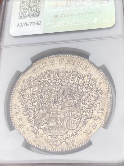 万国钱币拍卖第061期（马年首拍） NGC MS62 1777年德国勃兰登堡-安斯巴赫纹章大泰勒 拥有极其繁复纹章设计的18世纪德国泰勒 其淡包浆浮雕质感令人爱不释手