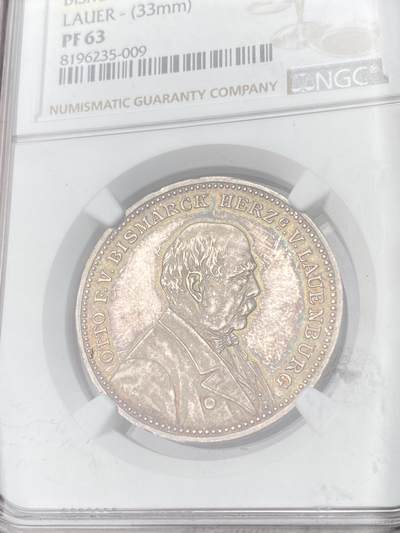 万国钱币拍卖第061期（马年首拍） NGC PF63 1895年德国帝国导航员首相俾斯麦80大寿纪念银章 原味孔雀绿环彩精制镜面 戎装日耳曼尼娅祝寿