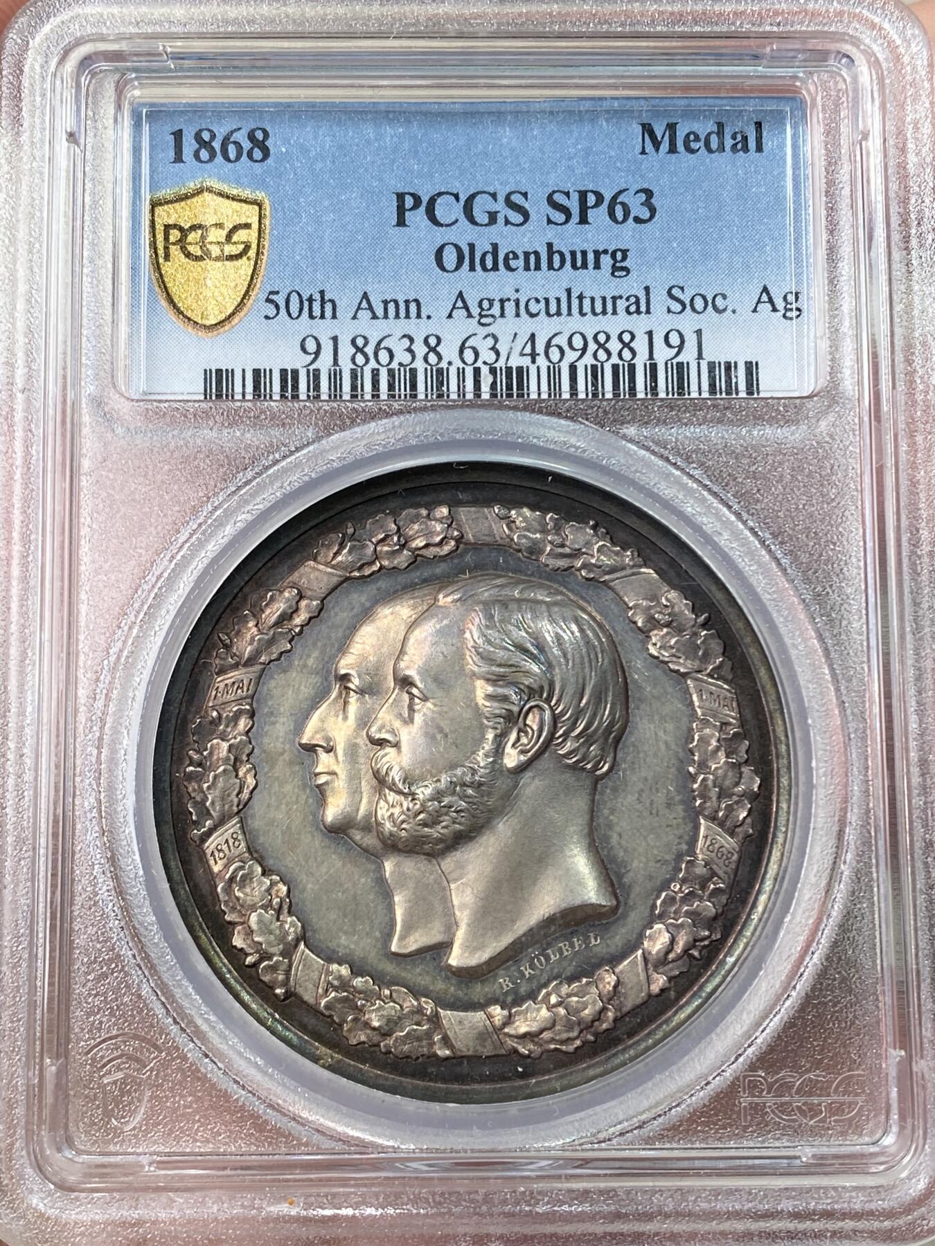 万国钱币拍卖第061期（马年首拍） PCGS SP63 1868年德国奥尔登堡大公国纪念奥尔登堡农业协会成立50周年大银章 正面奥尔登堡大公彼得·弗里德里希·路德维希与王后尼古拉斯·弗里德里希·彼得高浮雕侧相 背面农业女神端坐在中央 超高浮雕原味淡彩极美 罕见小邦品种收藏级品质 PC唯一亚军更高仅一枚