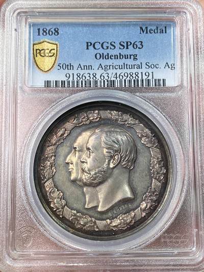 万国钱币拍卖第061期（马年首拍） PCGS SP63 1868年德国奥尔登堡大公国纪念奥尔登堡农业协会成立50周年大银章 正面奥尔登堡大公彼得·弗里德里希·路德维希与王后尼古拉斯·弗里德里希·彼得高浮雕侧相 背面农业女神端坐在中央 超高浮雕原味淡彩极美 罕见小邦品种收藏级品质 PC唯一亚军更高仅一枚