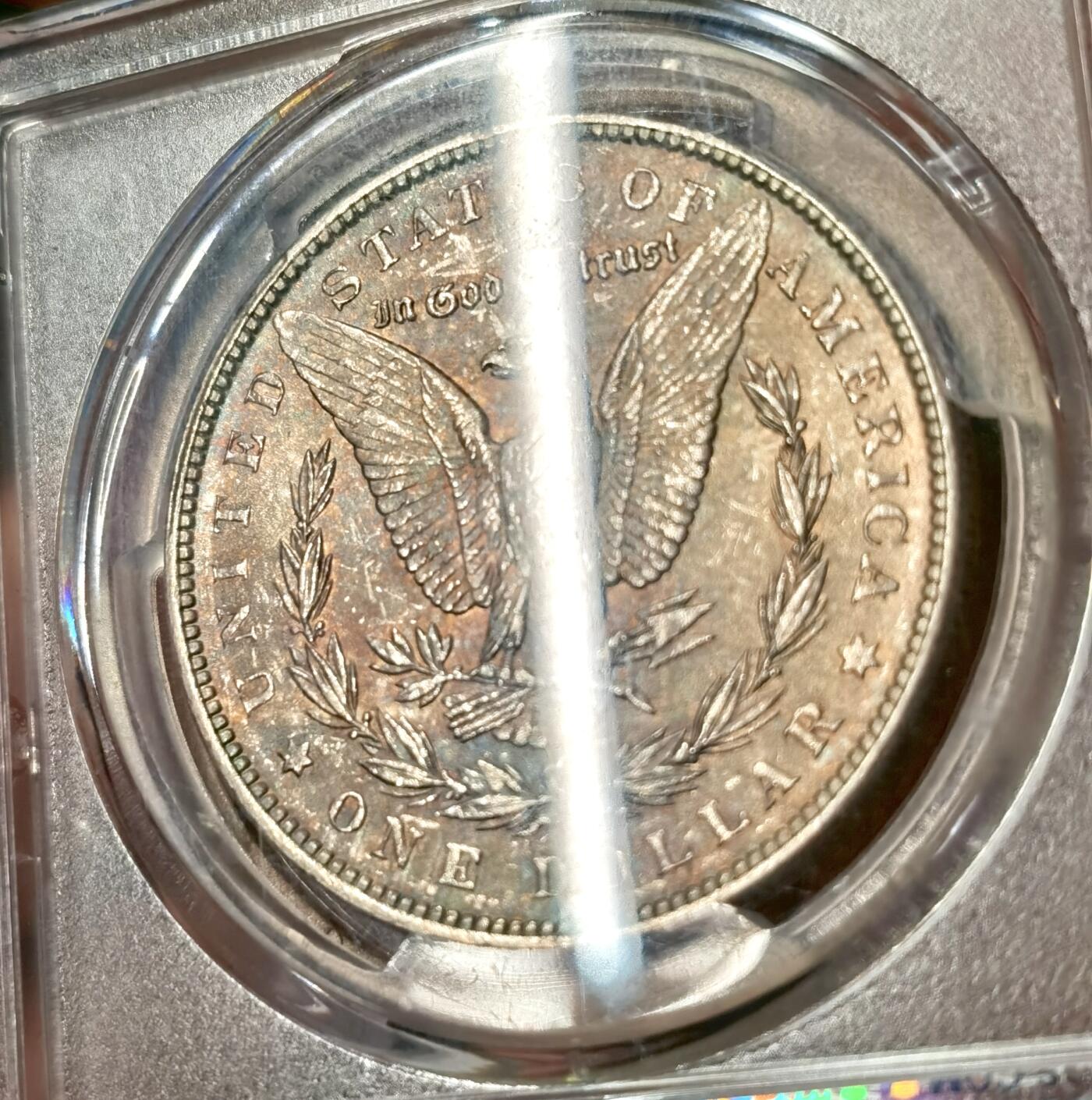 “福币呈祥”新年甄品场（直播拍卖）甄臻铺-世界币章拍卖（第50期），送拍享返佣金等优惠多多 PCGS-MS64 美国 1889年 摩根 银币 正面环彩带银霜 背面金彩带火烧云彩