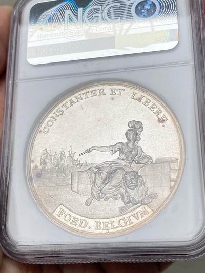 万国钱币拍卖第061期（马年首拍） NGC MS63 1763年尼德兰联省共和国巴黎合约纪念银章 44M 正面战神MARS收起利剑坐在战利品上 背面荷兰女神指向荷兰战舰标注坚定者和自由者 巴黎和约是1763年英、法、西班牙等国为结束七年战争而签订的和平条约 标志着欧洲列强在北美、印度等地殖民争霸的阶段性终结 顶级精铸镜面高浮雕喷砂收藏级品质 麦稀奇首拍超罕见品种