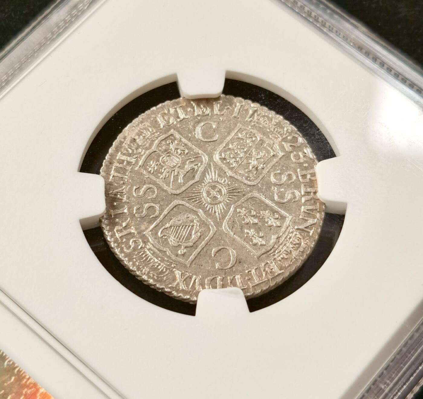 “福币呈祥”新年甄品场（直播拍卖）甄臻铺-世界币章拍卖（第50期），送拍享返佣金等优惠多多 NGC-MS63 英国 1723年 乔治一世SSC一先令银币 原味深包浆 高点清晰，顶级状态