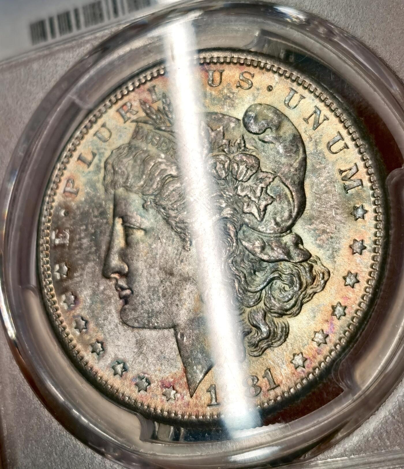 “福币呈祥”新年甄品场（直播拍卖）甄臻铺-世界币章拍卖（第50期），送拍享返佣金等优惠多多 PCGS MS65 美国 1881年S版 摩根$1银币 人面渐变五彩包浆 色泽自然过渡 层次丰富 实属难得