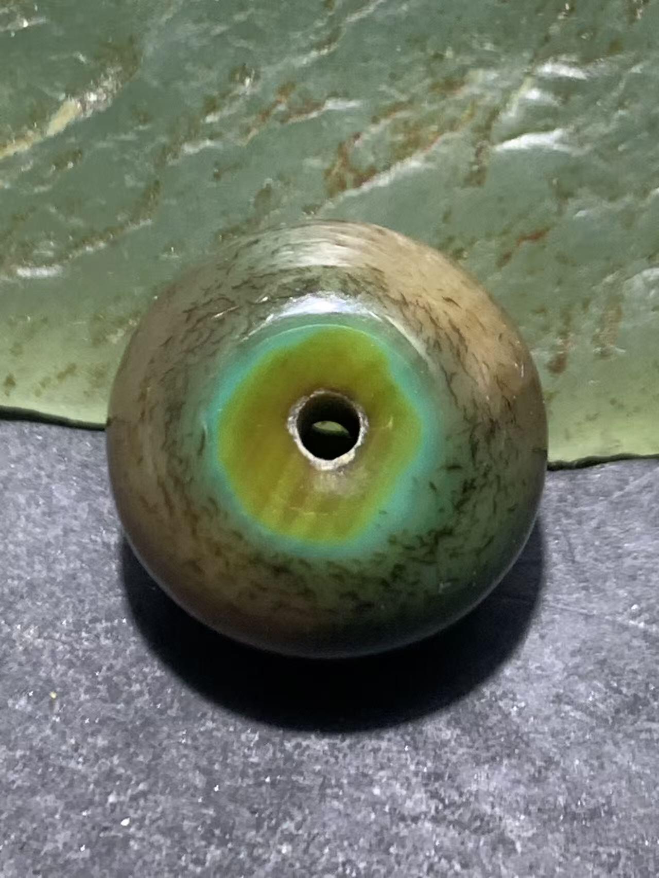 缠丝玛瑙算盘珠1颗，