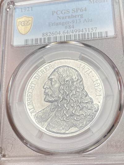 万国钱币拍卖第061期（马年首拍） PCGS SP64 1921年德国纽伦堡纪念日耳曼版画画圣阿尔布雷希特·丢勒诞辰450周年铝章 铝制罕见且相较其他材质更难以保存 背面纽伦堡城市远景精美异常 此枚精铸镜面喷砂质感 不失为此品种的顶级典藏品质 PC冠军分