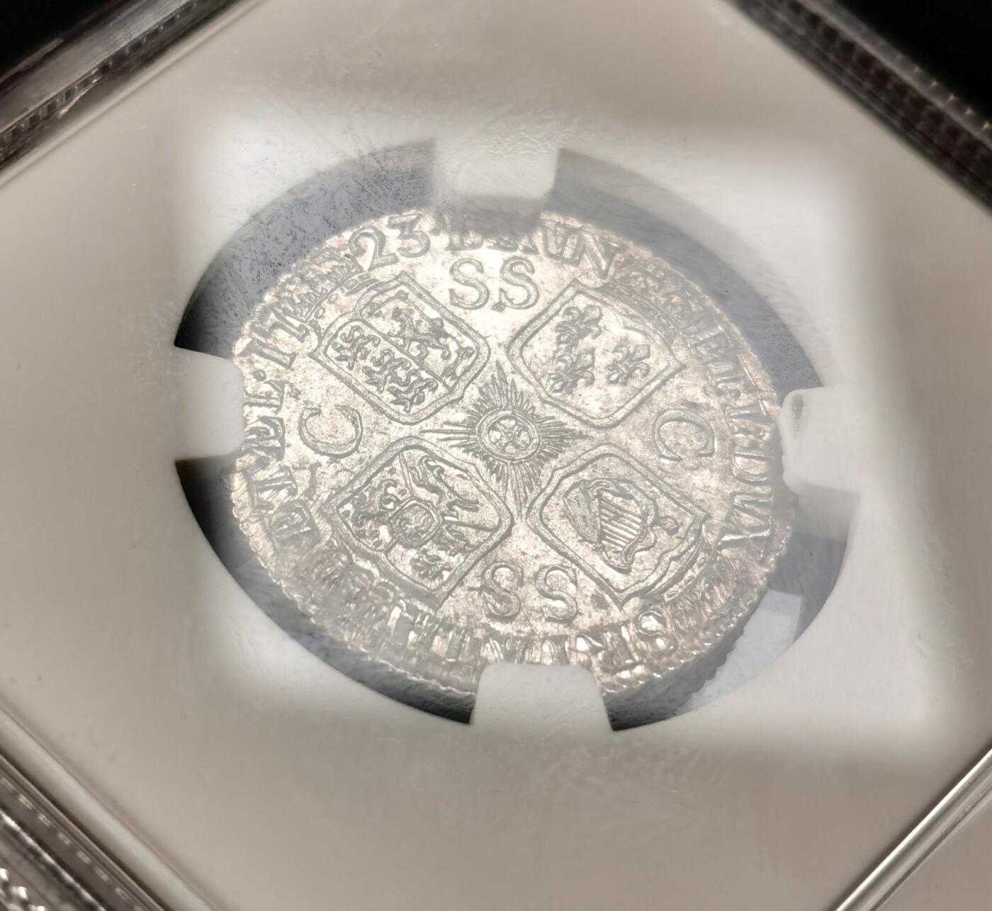 “福币呈祥”新年甄品场（直播拍卖）甄臻铺-世界币章拍卖（第50期），送拍享返佣金等优惠多多 NGC-MS63 英国 1723年 乔治一世SSC一先令银币 原味深包浆 高点清晰，顶级状态