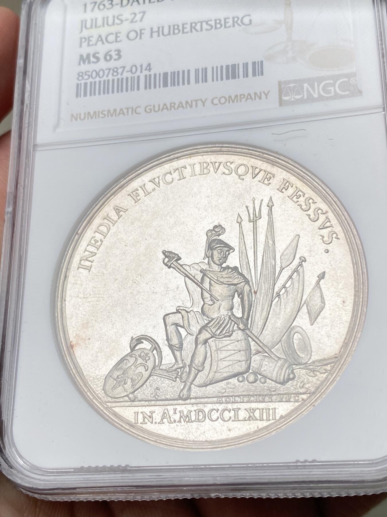 万国钱币拍卖第061期（马年首拍） NGC MS63 1763年尼德兰联省共和国巴黎合约纪念银章 44M 正面战神MARS收起利剑坐在战利品上 背面荷兰女神指向荷兰战舰标注坚定者和自由者 巴黎和约是1763年英、法、西班牙等国为结束七年战争而签订的和平条约 标志着欧洲列强在北美、印度等地殖民争霸的阶段性终结 顶级精铸镜面高浮雕喷砂收藏级品质 麦稀奇首拍超罕见品种