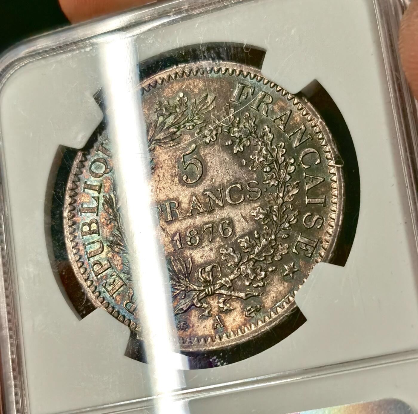 “福币呈祥”新年甄品场（直播拍卖）甄臻铺-世界币章拍卖（第50期），送拍享返佣金等优惠多多 NGC-UNC 1876年法国5法郎大银币 正面转光 背面包浆厚彩 适当养护可搏分