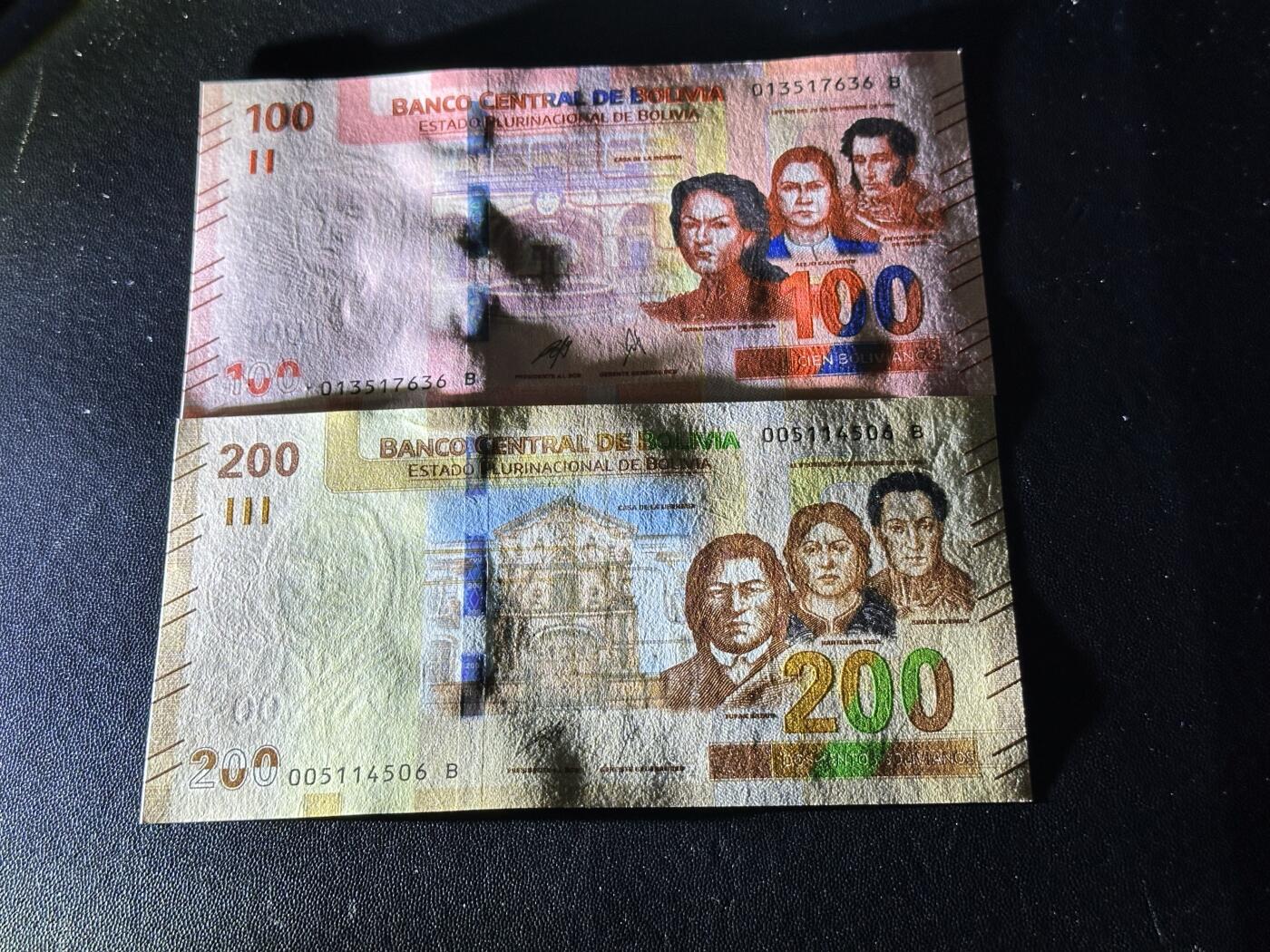 《外钞收藏家》第六百一十一期（农历新年第一场/快递恢复正常再发货）（长期征集拍品、欢迎藏友们联系合作） 玻利维亚100和200面额 2张一起 全新 尾（36、06）