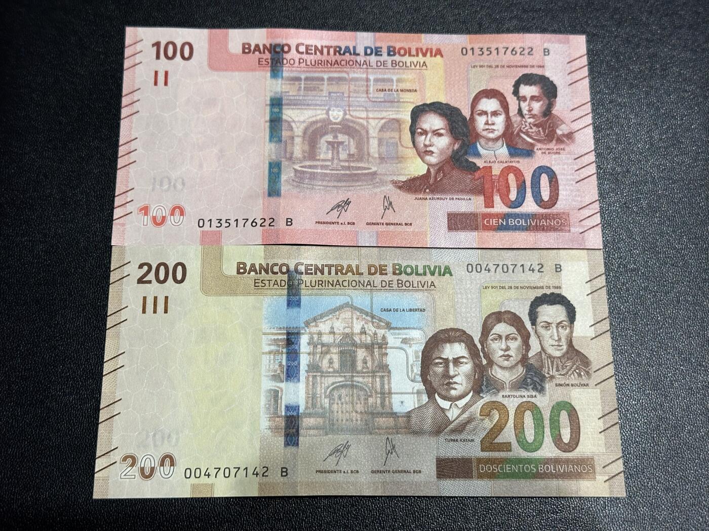 《外钞收藏家》第六百一十一期（农历新年第一场/快递恢复正常再发货）（长期征集拍品、欢迎藏友们联系合作） 玻利维亚100和200面额 2张一起 全新 尾（22、42）