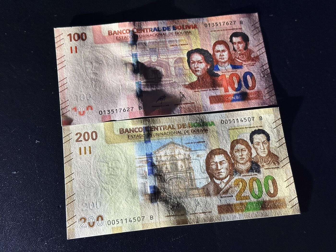 《外钞收藏家》第六百一十一期（农历新年第一场/快递恢复正常再发货）（长期征集拍品、欢迎藏友们联系合作） 玻利维亚100和200面额 2张一起 全新 尾（27、07）