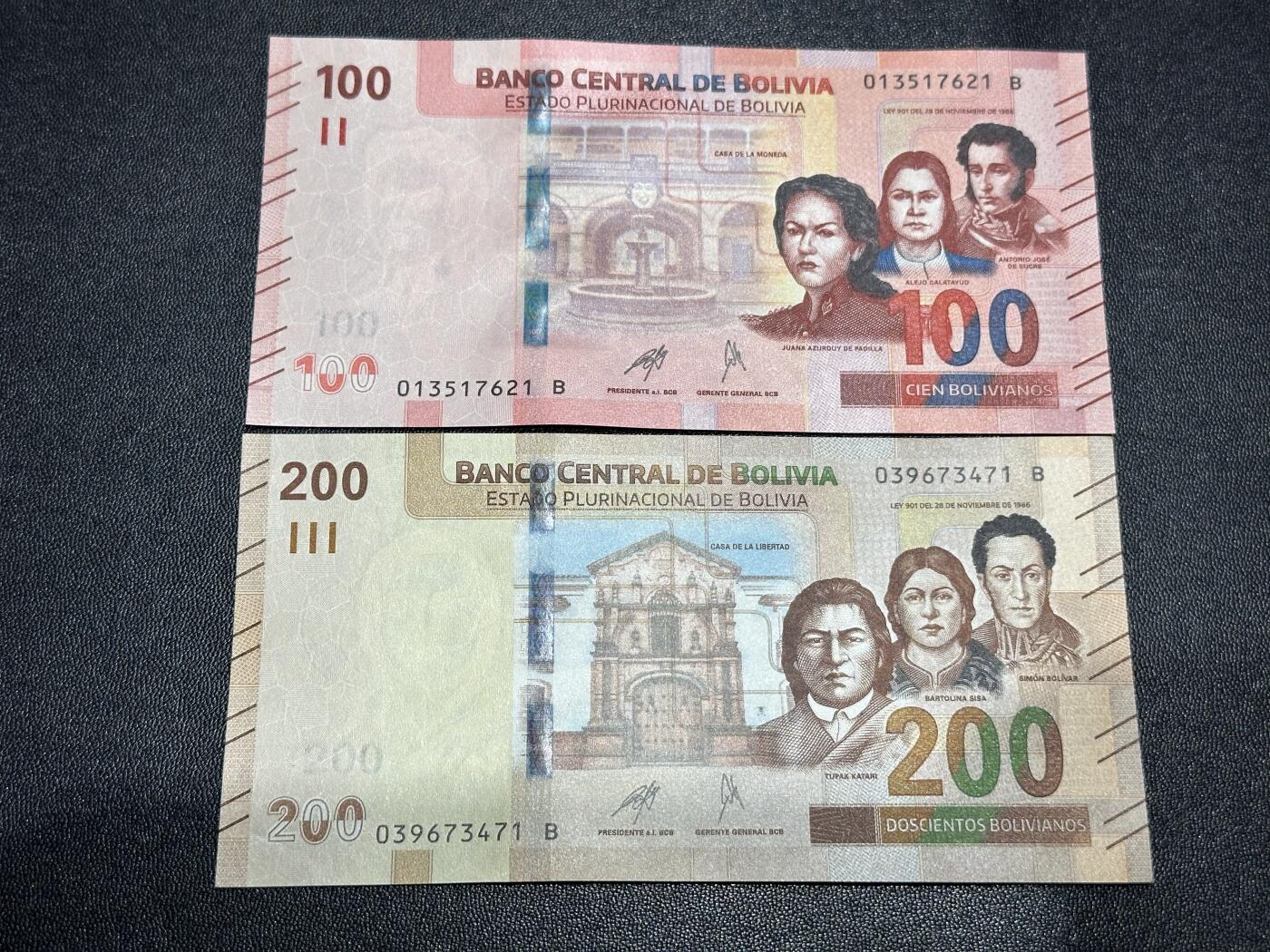 《外钞收藏家》第六百一十一期（农历新年第一场/快递恢复正常再发货）（长期征集拍品、欢迎藏友们联系合作） 玻利维亚100和200面额 2张一起 全新 尾（21、71）