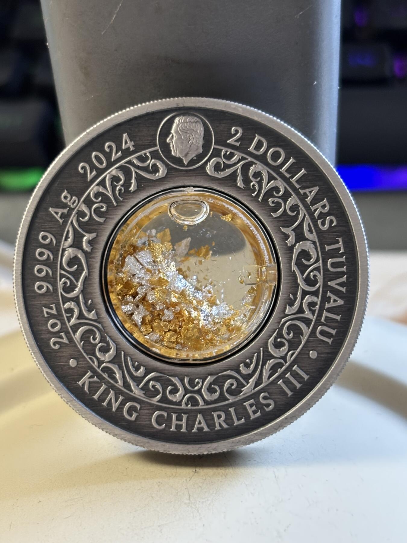 第191期拍卖 图瓦卢2024年阿利坎特凤凰2盎司镶嵌金银颗粒纪念银币，999银，发行2500枚