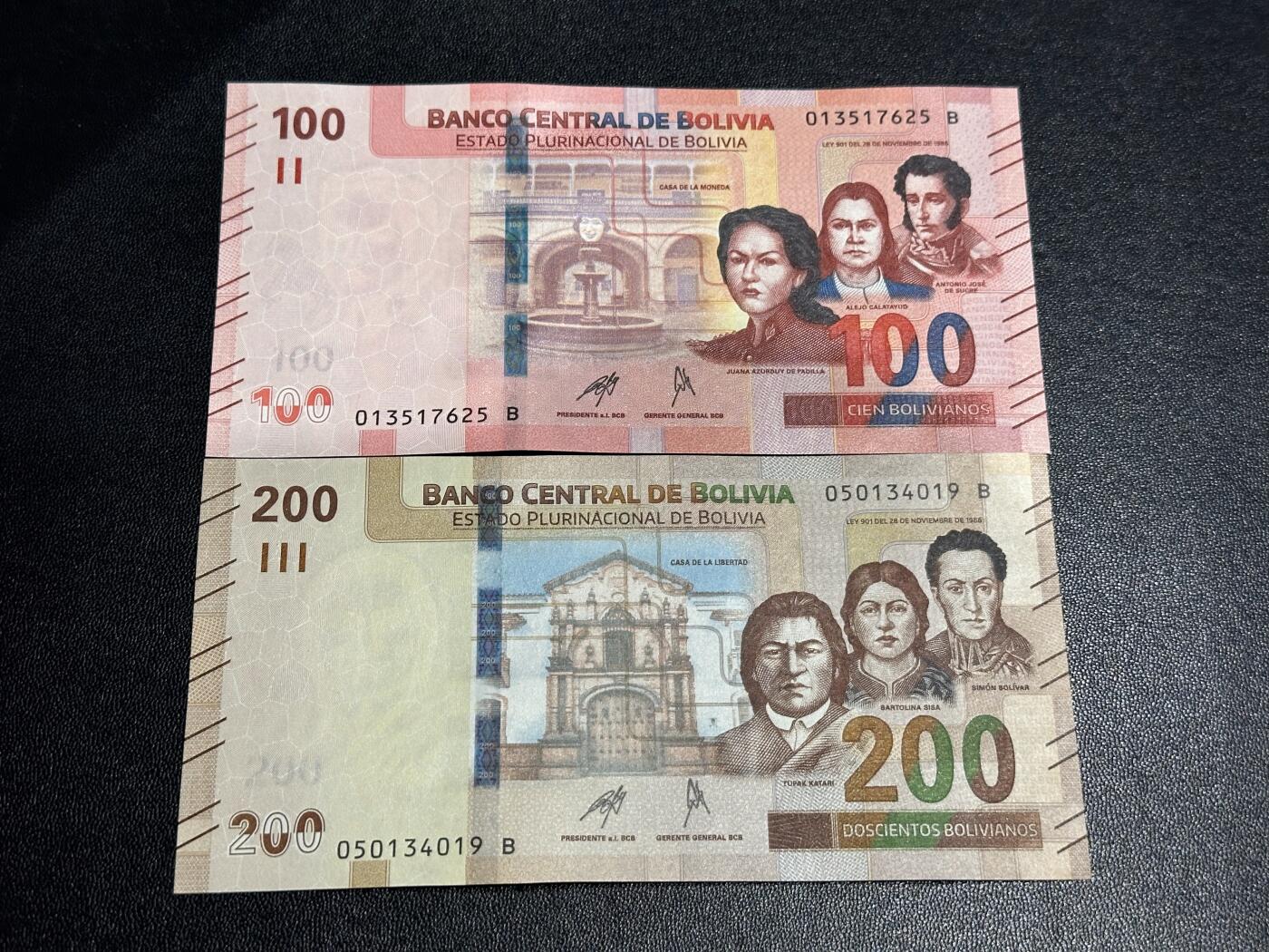 《外钞收藏家》第六百一十一期（农历新年第一场/快递恢复正常再发货）（长期征集拍品、欢迎藏友们联系合作） 玻利维亚100和200面额 2张一起 全新 尾（25、19）2个角不绝