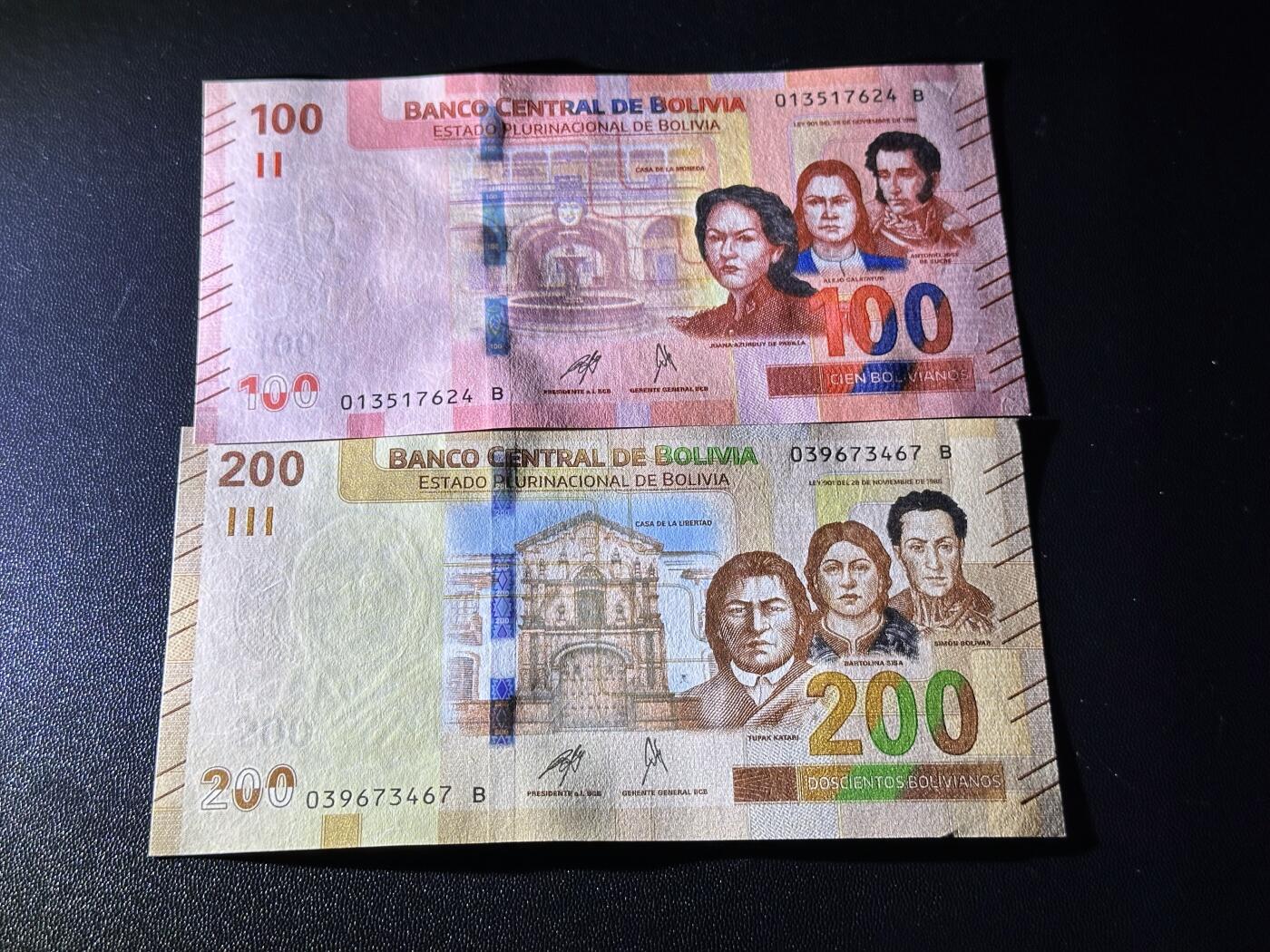 《外钞收藏家》第六百一十一期（农历新年第一场/快递恢复正常再发货）（长期征集拍品、欢迎藏友们联系合作） 玻利维亚100和200面额 2张一起 全新 尾（24、67）