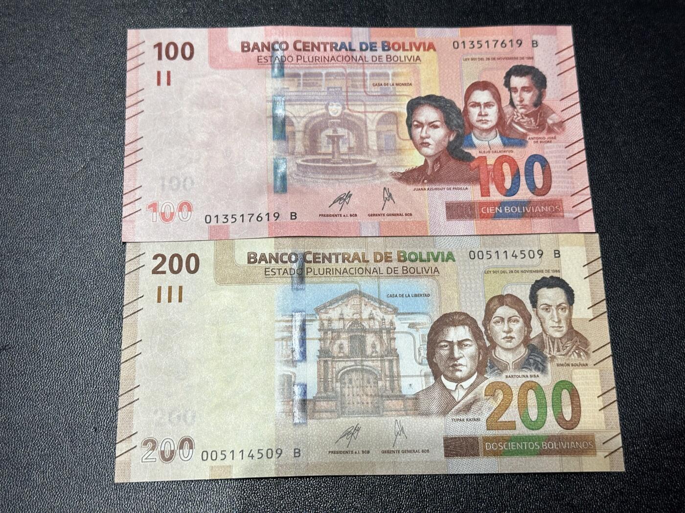 《外钞收藏家》第六百一十一期（农历新年第一场/快递恢复正常再发货）（长期征集拍品、欢迎藏友们联系合作） 玻利维亚100和200面额 2张一起 全新 尾（19、09）