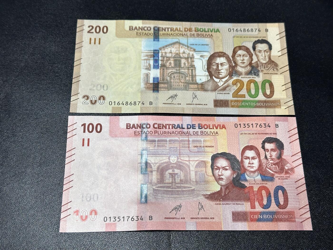 《外钞收藏家》第六百一十一期（农历新年第一场/快递恢复正常再发货）（长期征集拍品、欢迎藏友们联系合作） 玻利维亚100和200面额 2张一起 全新 尾（74、34）