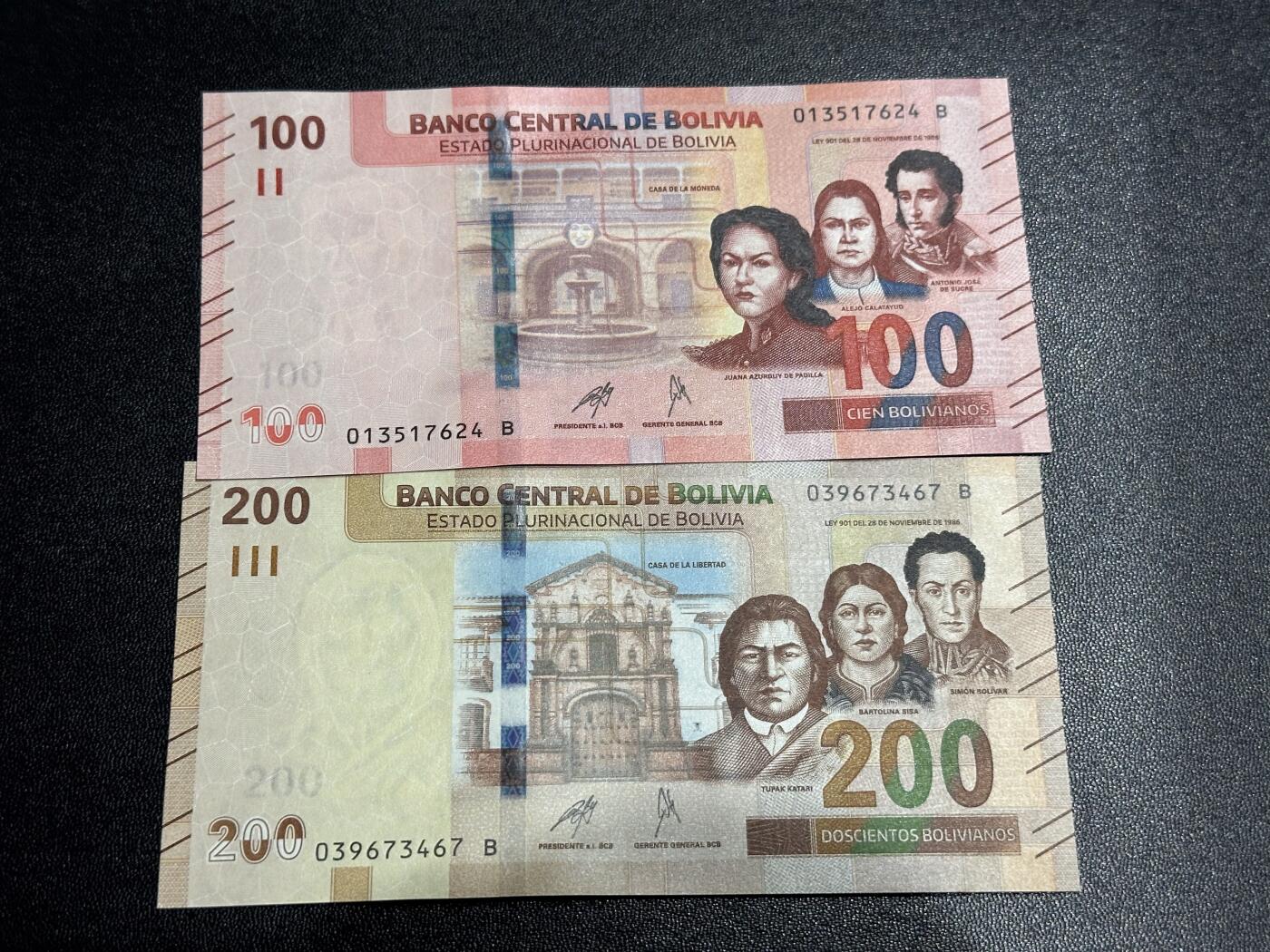 《外钞收藏家》第六百一十一期（农历新年第一场/快递恢复正常再发货）（长期征集拍品、欢迎藏友们联系合作） 玻利维亚100和200面额 2张一起 全新 尾（24、67）