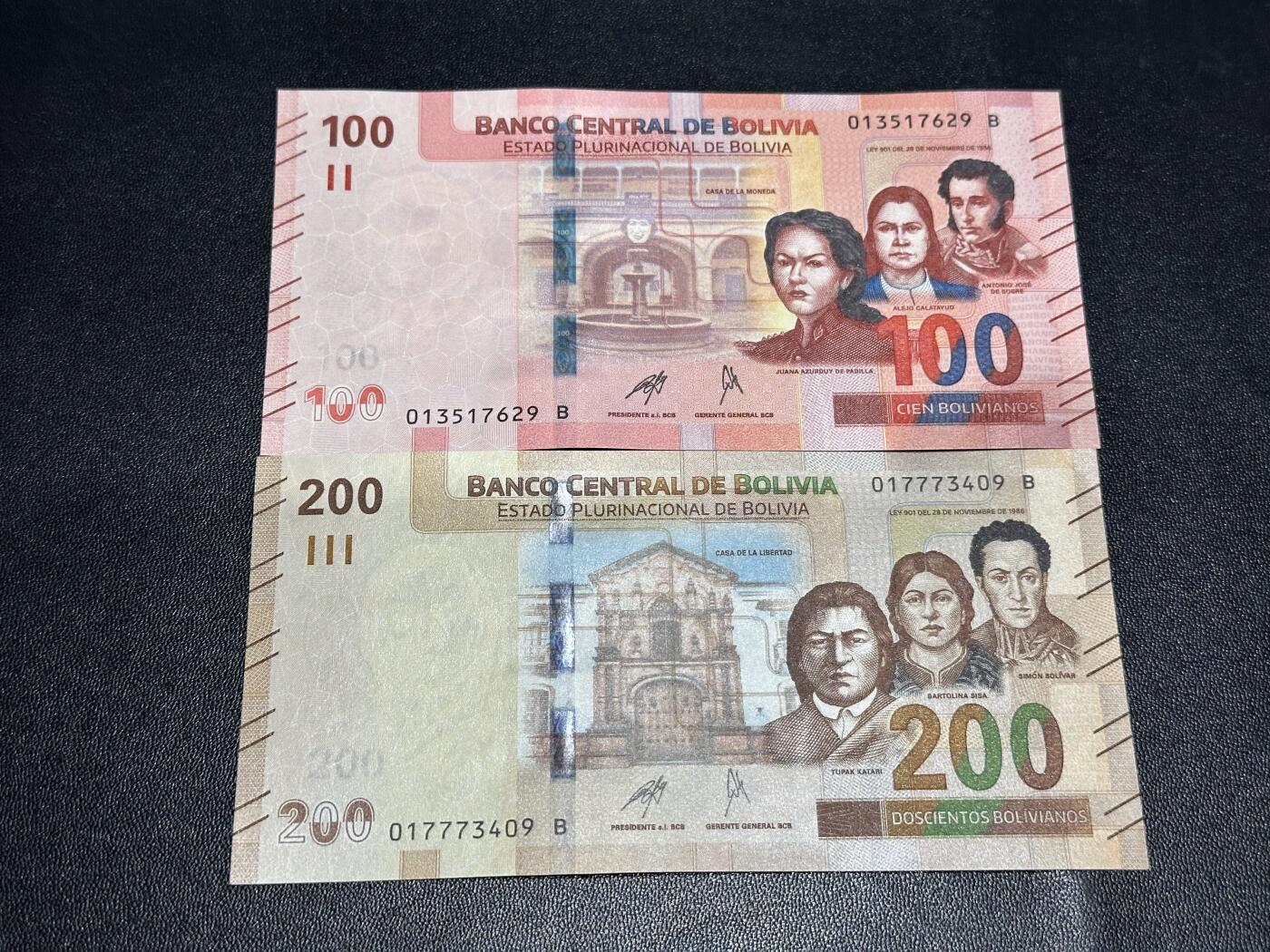 《外钞收藏家》第六百一十一期（农历新年第一场/快递恢复正常再发货）（长期征集拍品、欢迎藏友们联系合作） 玻利维亚100和200面额 2张一起 全新 尾（29、09）一个角不绝