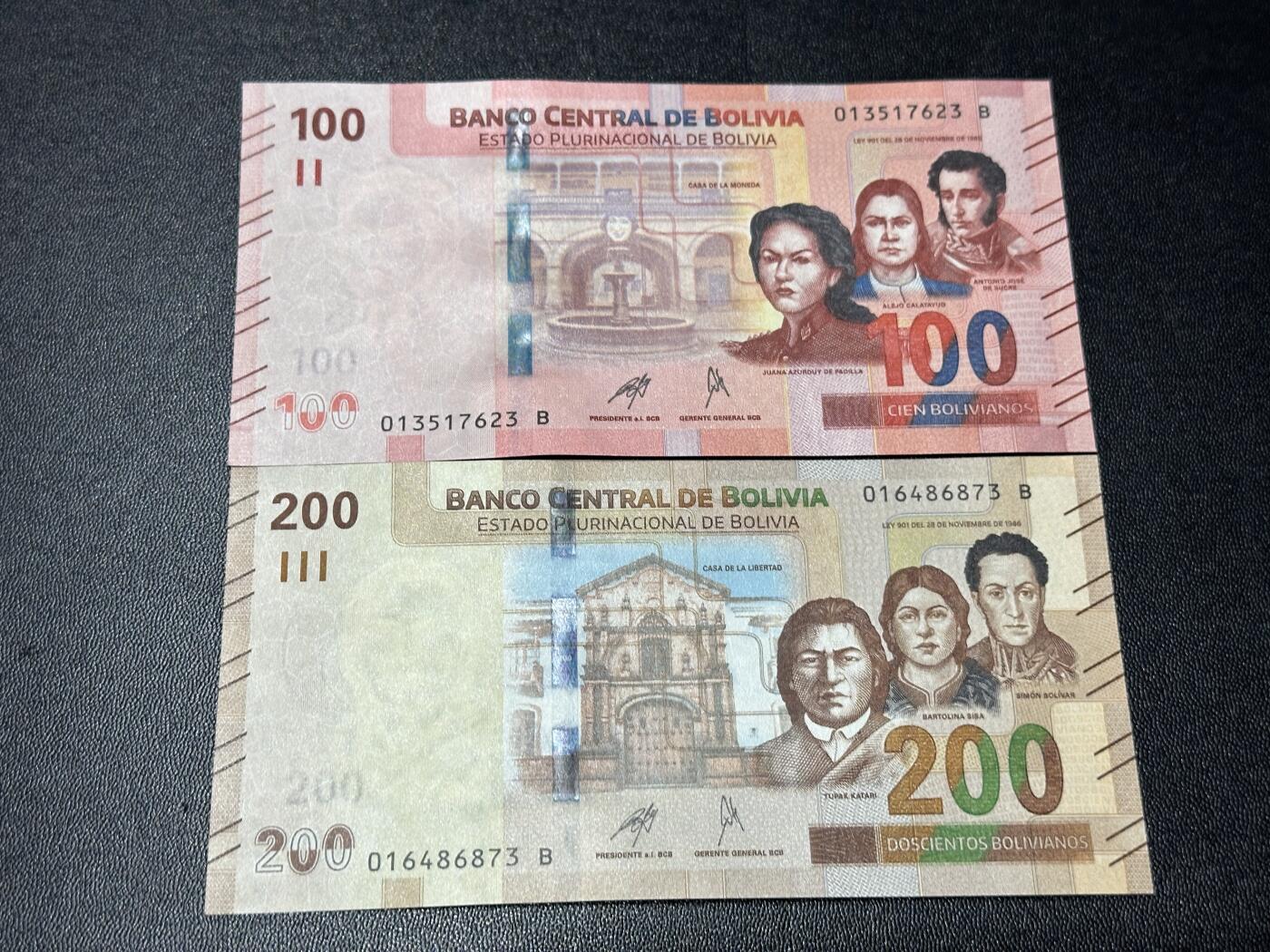 《外钞收藏家》第六百一十一期（农历新年第一场/快递恢复正常再发货）（长期征集拍品、欢迎藏友们联系合作） 玻利维亚100和200面额 2张一起 全新 尾（23、73）