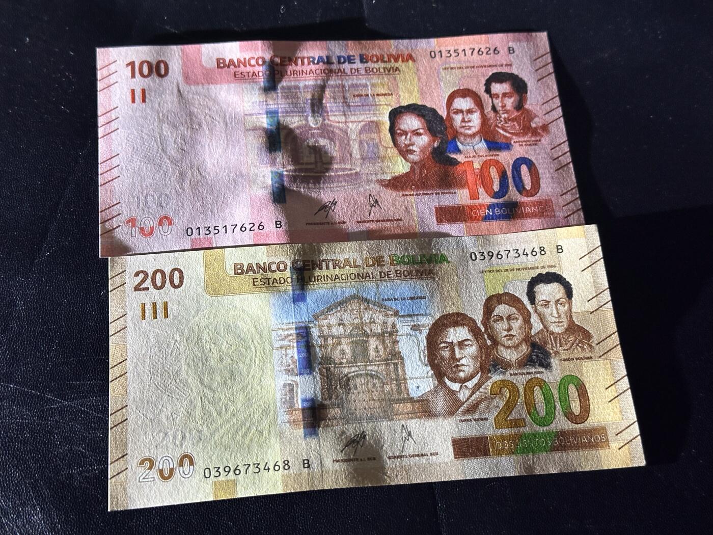 《外钞收藏家》第六百一十一期（农历新年第一场/快递恢复正常再发货）（长期征集拍品、欢迎藏友们联系合作） 玻利维亚100和200面额 2张一起 全新 尾（26、68）