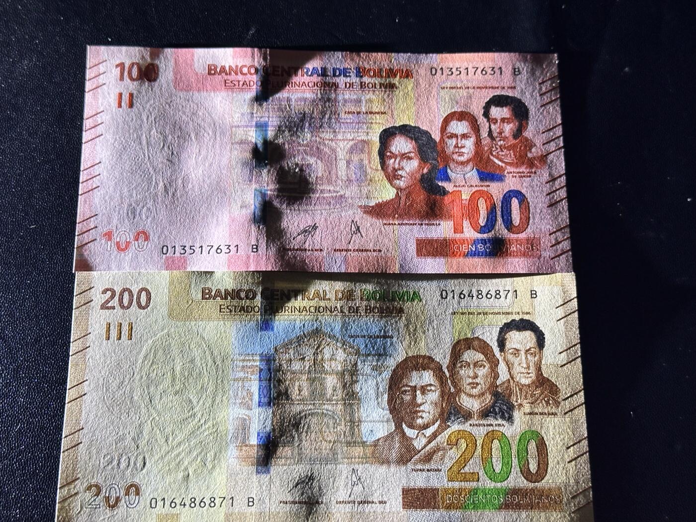 《外钞收藏家》第六百一十一期（农历新年第一场/快递恢复正常再发货）（长期征集拍品、欢迎藏友们联系合作） 玻利维亚100和200面额 2张一起 全新 尾（31、71）