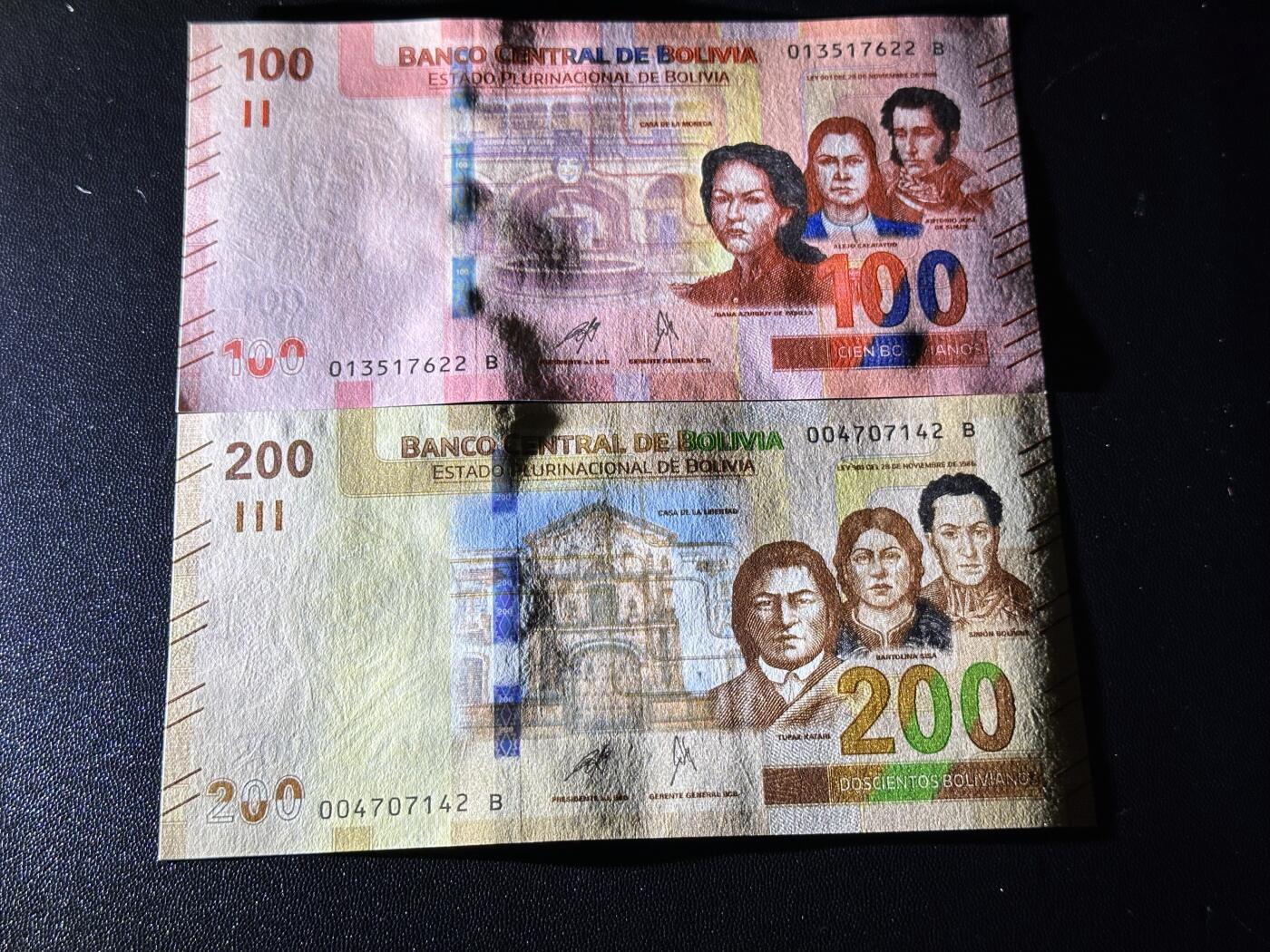 《外钞收藏家》第六百一十一期（农历新年第一场/快递恢复正常再发货）（长期征集拍品、欢迎藏友们联系合作） 玻利维亚100和200面额 2张一起 全新 尾（22、42）