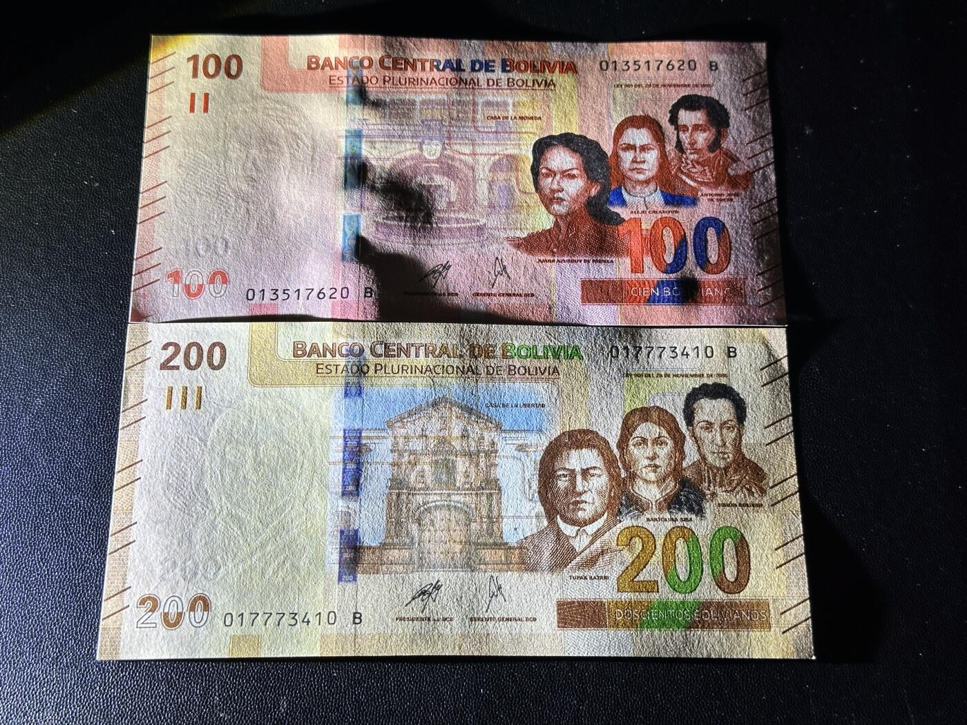 《外钞收藏家》第六百一十一期（农历新年第一场/快递恢复正常再发货）（长期征集拍品、欢迎藏友们联系合作） 玻利维亚100和200面额 2张一起 全新 尾（20、10）一个角不绝